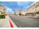 Street view features a sidewalk-lined street with attractive townhomes, each with its own garage at 4833 Straight Flush Dr # 103, Las Vegas, NV 89122