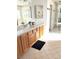 Light bathroom with bright vanity and tile flooring at 5104 Burr Oak Dr, Las Vegas, NV 89130