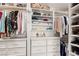 Walk-in closet with built-in storage drawers, shelves, rods, and vanity space at 5104 Burr Oak Dr, Las Vegas, NV 89130