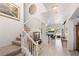Inviting entryway with staircase leading to the upper level and an open living area at 5104 Burr Oak Dr, Las Vegas, NV 89130