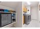 Laundry room featuring ample storage space, including cabinetry and open shelving at 5104 Burr Oak Dr, Las Vegas, NV 89130