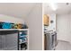 Laundry room featuring ample storage space, including cabinetry and open shelving at 5104 Burr Oak Dr, Las Vegas, NV 89130