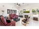 Comfortable living room with fireplace, tiled floors and a television at 5104 Burr Oak Dr, Las Vegas, NV 89130
