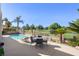 Backyard view showcasing the sparkling pool and luxurious lounge area overlooking the golf course at 5104 Burr Oak Dr, Las Vegas, NV 89130