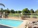 Inviting backyard pool area with lounge chairs and a view of the golf course at 5104 Burr Oak Dr, Las Vegas, NV 89130