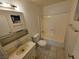 A simple bathroom with a vanity, toilet, and shower/tub combination at 5440 Swenson St # 18, Las Vegas, NV 89119