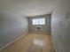 A basic empty bedroom with tile floors and a window at 5440 Swenson St # 18, Las Vegas, NV 89119