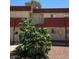 Exterior view of a multi-Gathering home with muted color scheme, a small balcony, and minimal landscaping at 5440 Swenson St # 18, Las Vegas, NV 89119