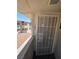 Apartment front entrance with security gate, and exterior view of the property at 5440 Swenson St # 18, Las Vegas, NV 89119