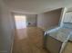 Spacious living room area with tile flooring and view of an open counter at 5440 Swenson St # 18, Las Vegas, NV 89119