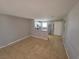 Open-concept living area featuring tile floors and view into the kitchen at 5440 Swenson St # 18, Las Vegas, NV 89119