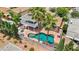 Aerial view highlighting a private backyard with a kidney-shaped pool, ample patio space, and mature palm trees at 601 Cragin Park Dr, Las Vegas, NV 89107