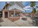 Relaxing backyard showcasing a pristine pool, patio with seating, and a charming balcony above at 601 Cragin Park Dr, Las Vegas, NV 89107
