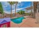 Enjoy a beautiful backyard with a refreshing pool and lush landscaping at 601 Cragin Park Dr, Las Vegas, NV 89107