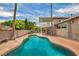Sparkling backyard pool with tropical landscaping and patio area, perfect for relaxation at 601 Cragin Park Dr, Las Vegas, NV 89107