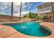 Large pool with brick coping and an outdoor seating area at 601 Cragin Park Dr, Las Vegas, NV 89107