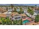 Aerial view of a private backyard with a refreshing in-ground pool, patio, and a covered balcony at 601 Cragin Park Dr, Las Vegas, NV 89107