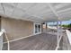 Expansive covered balcony with white railing and plank flooring, perfect for entertaining at 601 Cragin Park Dr, Las Vegas, NV 89107