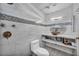 Modern bathroom with stylish vanity, white tiled walls, and mosaic tile accents at 601 Cragin Park Dr, Las Vegas, NV 89107
