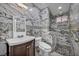 Modern bathroom featuring marble-style tiling, a glass-enclosed shower, and elegant fixtures for a luxurious feel at 601 Cragin Park Dr, Las Vegas, NV 89107