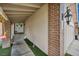 Home exterior featuring a covered entryway with brick accents and a well-lit walkway at 601 Cragin Park Dr, Las Vegas, NV 89107