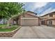 Charming single-story home featuring a well-manicured lawn and mature trees in a desirable neighborhood at 601 Cragin Park Dr, Las Vegas, NV 89107