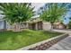 Charming home featuring a well-manicured lawn and mature trees in the front yard at 601 Cragin Park Dr, Las Vegas, NV 89107