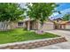 Charming single-story home featuring a well-manicured lawn and mature trees in a desirable neighborhood at 601 Cragin Park Dr, Las Vegas, NV 89107