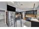 Bright kitchen featuring stainless steel appliances and stylish black cabinetry, perfect for modern living at 601 Cragin Park Dr, Las Vegas, NV 89107