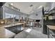 Open-concept kitchen featuring sleek black cabinetry and wood backsplash at 601 Cragin Park Dr, Las Vegas, NV 89107