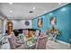 Elegant living room with glass dining table, decor, and accent wall with a vintage grandfather clock at 601 Cragin Park Dr, Las Vegas, NV 89107