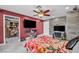 Large main bedroom featuring a walk-in closet, ceiling fan and television at 601 Cragin Park Dr, Las Vegas, NV 89107