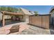 Private backyard with a covered patio, firepit, and convenient storage shed for outdoor essentials at 601 Ordrich Pl, Las Vegas, NV 89145