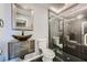 Modern bathroom featuring a unique glass bowl sink and glass-enclosed shower at 601 Ordrich Pl, Las Vegas, NV 89145
