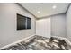 Cozy bedroom with a large window, built-in storage and unique flooring at 601 Ordrich Pl, Las Vegas, NV 89145