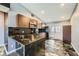 Modern kitchen with granite countertops, stainless steel appliances, and updated cabinets at 601 Ordrich Pl, Las Vegas, NV 89145