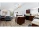 Open concept kitchen with granite countertops, stainless steel appliances, and a connected living area at 610 Playa Del Sol Way, Henderson, NV 89015