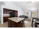 Inviting living area with hardwood floors and open floor plan, connecting to a modern kitchen at 610 Playa Del Sol Way, Henderson, NV 89015