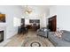 Comfortable living area with modern furnishings, hardwood floors, and seamless connection to the kitchen at 610 Playa Del Sol Way, Henderson, NV 89015