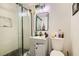 A bathroom featuring a glass door shower, a sink and a toilet at 613 Stanford St, Las Vegas, NV 89107