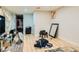 Bedroom with wood-style floors, simple furnishings, and a view into an accessible closet at 613 Stanford St, Las Vegas, NV 89107