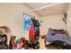 A bedroom with toys, a TV, and personal items at 613 Stanford St, Las Vegas, NV 89107
