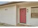 Close-up of the inviting front door with paneled detailing, a lantern, and visible house number 613 at 613 Stanford St, Las Vegas, NV 89107