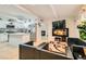 Open-concept layout with cozy seating, modern décor, hardwood floors, and a glimpse of the kitchen at 613 Stanford St, Las Vegas, NV 89107