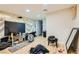 View of the living room with wood floors and a large TV at 613 Stanford St, Las Vegas, NV 89107
