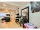 Inviting living room with wood-style flooring, a front door, and a peek into the kitchen at 613 Stanford St, Las Vegas, NV 89107