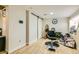 Uncluttered room featuring sliding barn doors, a salon chair, and wood-style flooring at 613 Stanford St, Las Vegas, NV 89107