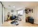 Functional room featuring wood-style flooring and a wall mirror with a hair salon chair at 613 Stanford St, Las Vegas, NV 89107