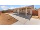 Backyard view featuring a patio and low-maintenance gravel landscaping at 6140 Passionate Ct, North Las Vegas, NV 89031