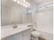 Bright bathroom features white cabinets, tile flooring and shower and tub combo at 6140 Passionate Ct, North Las Vegas, NV 89031